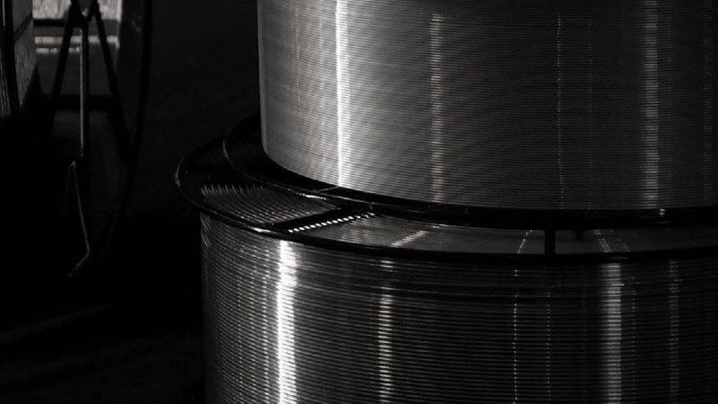 Two aluminium wire spools stacked