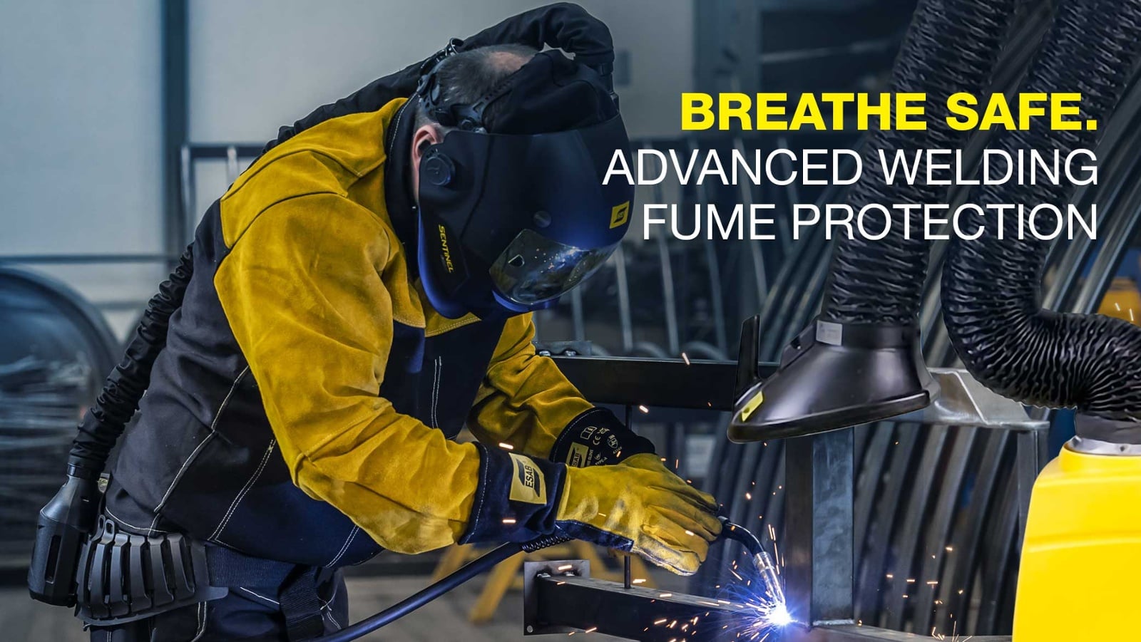 Welder using PPE and fume extraction system