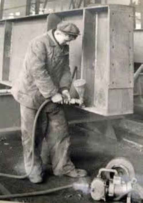 Historical photo of a man welding