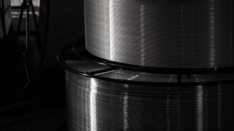 Two aluminium wire spools stacked